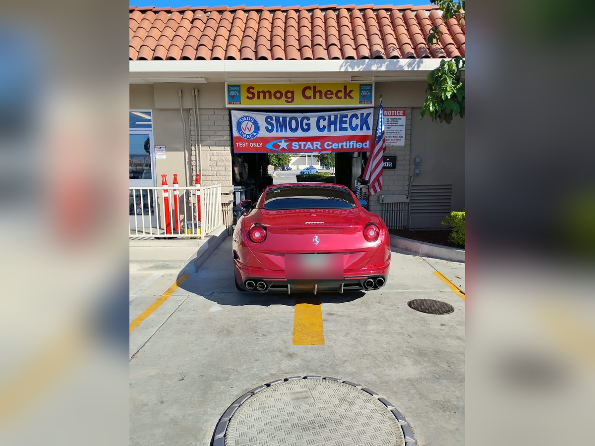 A sports car getting a STAR Certified smog check at Simi Smog & Wash, a test-only STAR station in Simi Valley, California